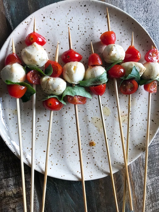 Nutrition kebabs with tomato, mozzarella, and basil 