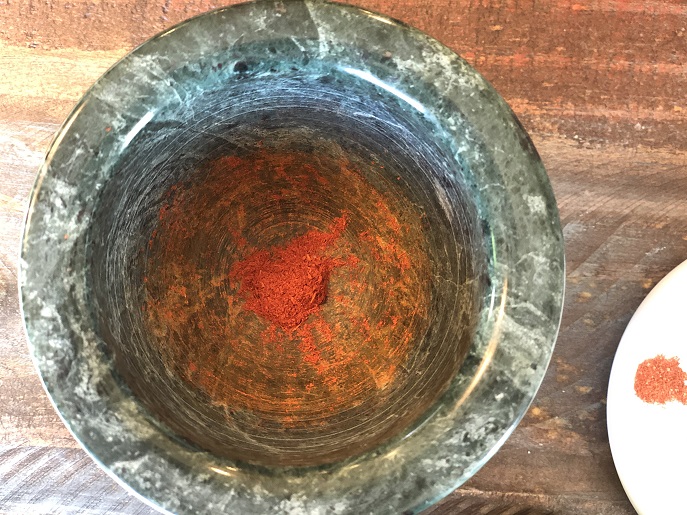 Ground saffron in mortar
