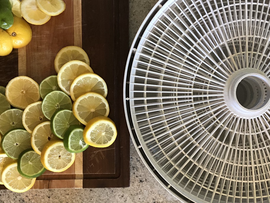 sliced lemons and limes with a dehydrator